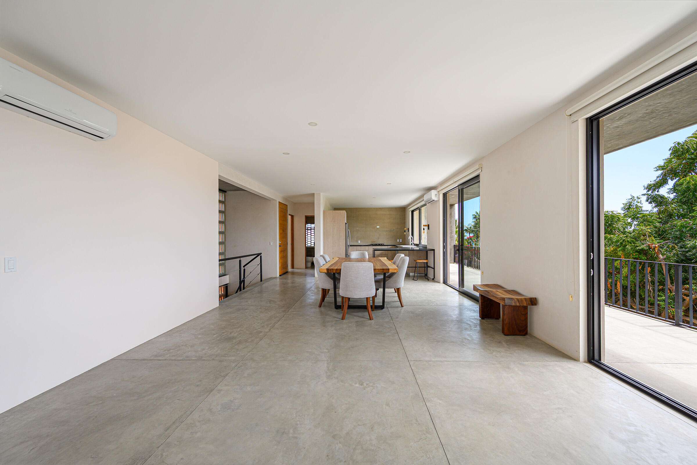 San Jose del Cabo Gringo Hill Tucked into the coveted hillside community of Gringo Hills in Costa Azul, Casa Asha is a contemporary residence by architect Gonzalo Elizarraras. Set on a 519SM lot, the three-bedroom home blends natural Baja materials with modern architecture, open living spaces, and expansive terraces. The upper-level living, dining, and kitchen flow to a generous terrace, while the lower level opens to a lush garden ideal for entertaining under the shade of mature trees. The rooftop offers a versatile space perfect for sunrise yoga, morning coffee, or a barbecue overlooking the Sea of Cortez. A brief 900-meters to the shores of Costa Azul and minutes from San José's historic center, Gringo Hills offers a relaxed lifestyle loved by surfers, artists, and long-time locals. for sale