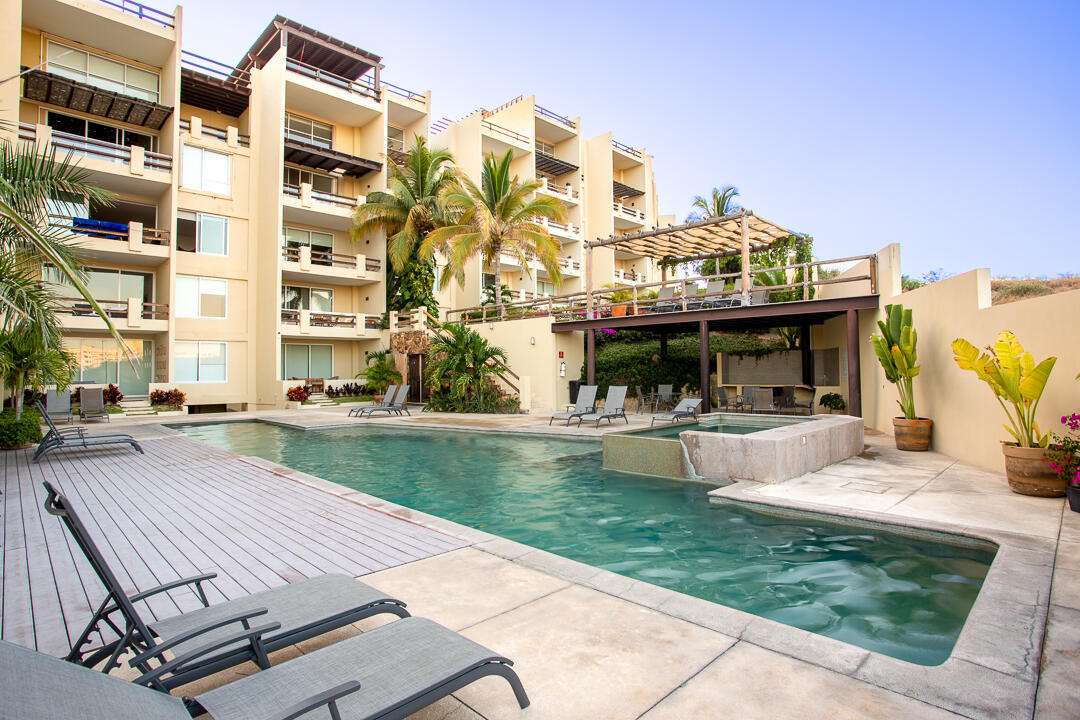 San Jose del Cabo Casa Nima This stunning condo welcomes you with an inviting entry that flows into a beautifully designed, fully equipped kitchen with granite countertops and premium appliances. The dining area features soaring ceilings that fill the space with light and elegance. Spacious bedrooms offer comfort and tranquility, all enhanced by the distinctive touch of architect Ezquerra. Surrounded by exceptional resort-style amenities, this is more than a home, it's a place where every day feels like a getaway. – 702 Paso de Las Misiones, San Jose del Cabo, BS
