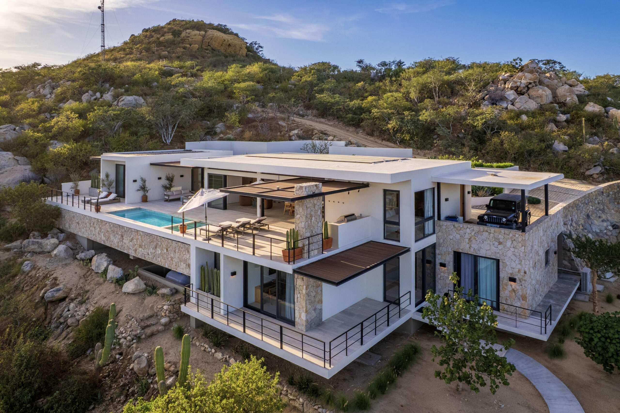 San Jose del Cabo Laguna Hills Casa Savoy is a modern 4014 square foot, four-bedroom hillside home, built in 2024, in Laguna Hills, offering breathtaking ocean for sale