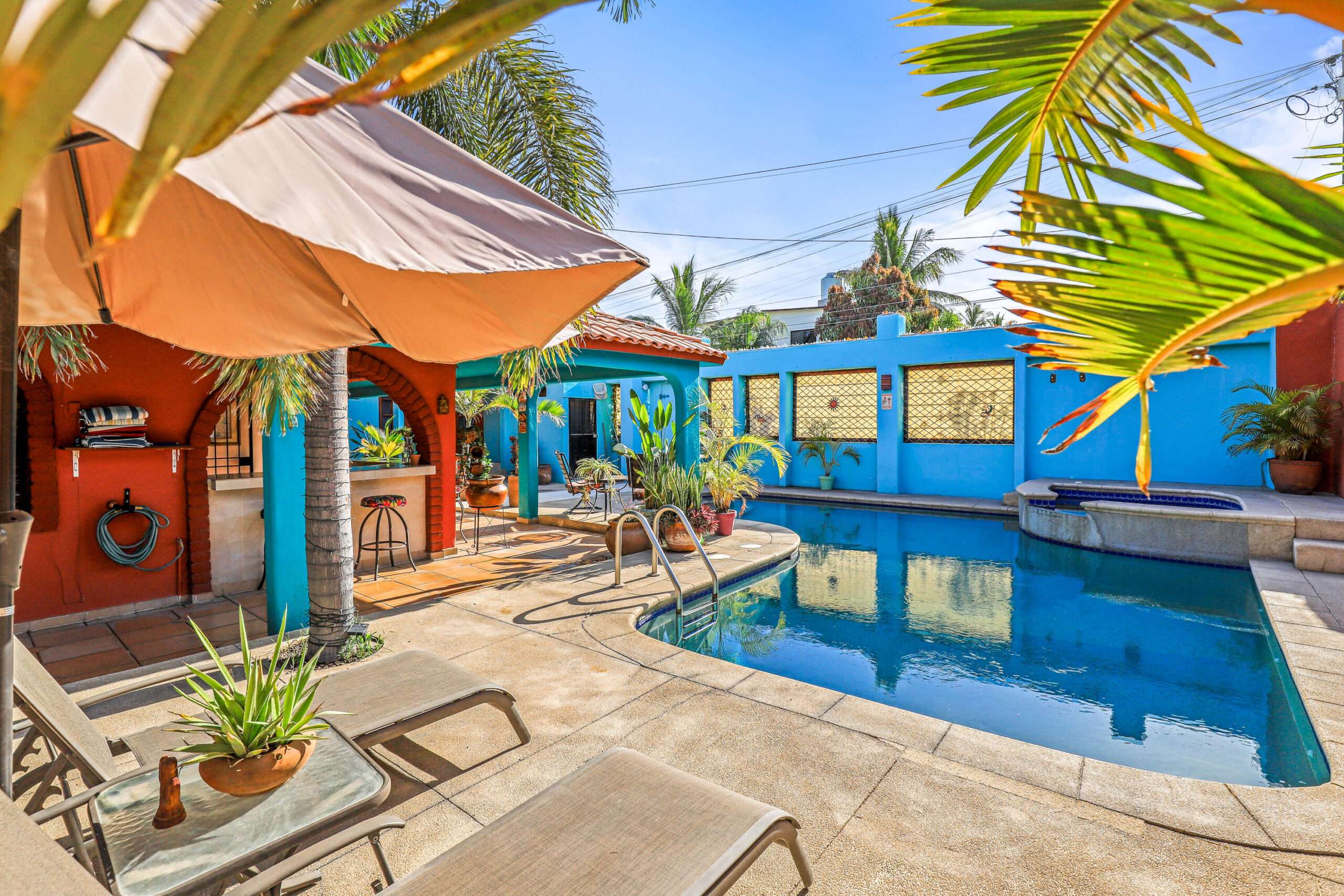 San Jose del Cabo Zacatal Situated in a well established colony in northern San José del Cabo, this colorful 4-bed hacienda-style home is fully walled for privacy. Ideal for Airbnb or family living, it features a casita/office, indoor/outdoor kitchen with BBQ, pool, hot tub, outdoor shower, garage, rooftop seating, mature landscaping, and is offered furnished with appliances and mini-splits.Ubicada en una colonia establecida al norte de San José del Cabo, esta colorida casa estilo hacienda de 4 recámaras está totalmente bardeada para privacidad. Ideal para Airbnb o familia, cuenta con casita/oficina, cocina interior y exterior con BBQ, alberca, jacuzzi, regadera exterior, cochera, área en azotea y se vende amueblada con minisplits. for sale