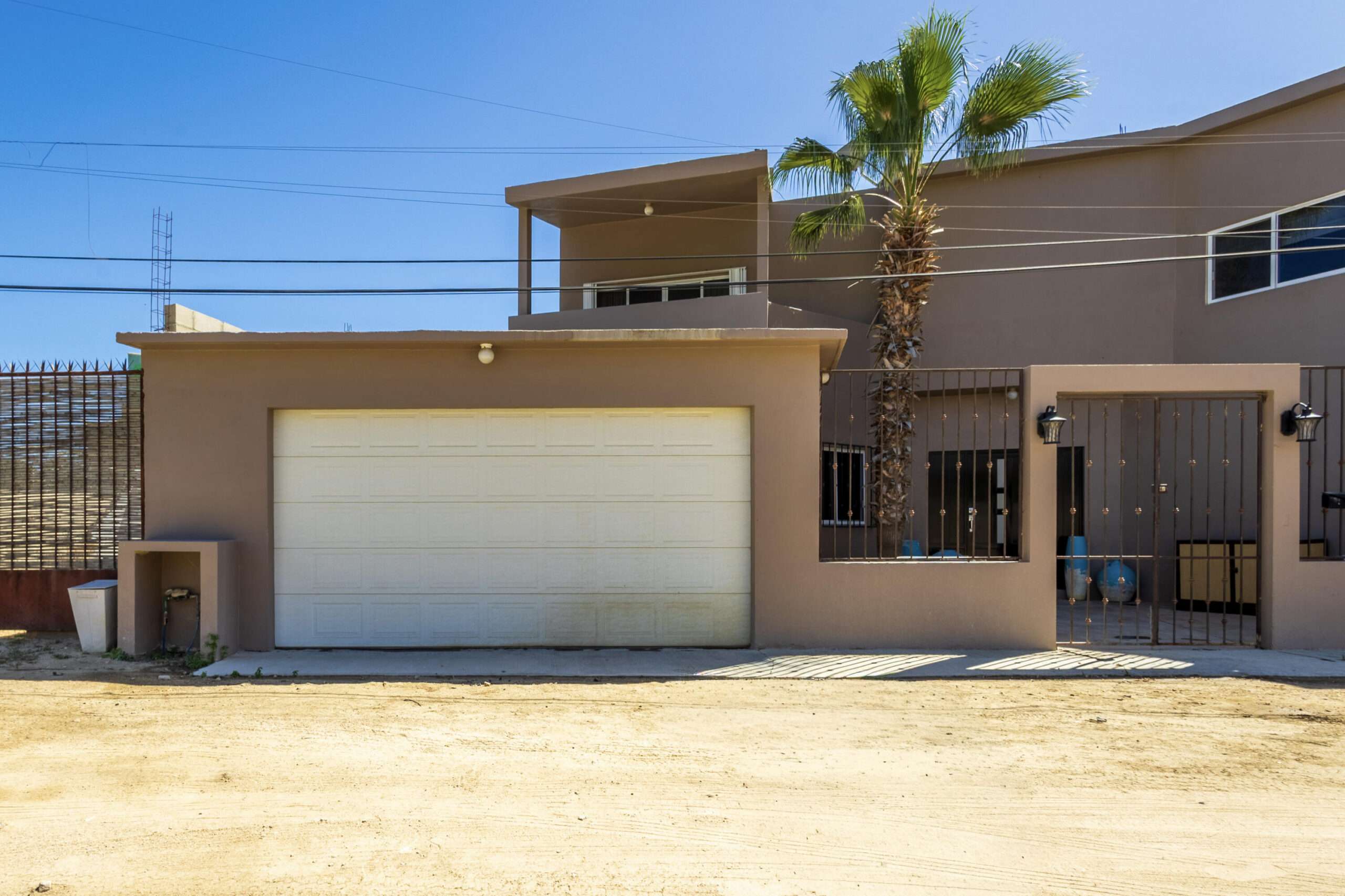 San Jose del Cabo Gringo Hill Located in the original San José del Cabo surfing community of Gringo Hill, this fully gated and walled residence offers exceptional space, privacy, and flexibility for full-time living or a second home close to shopping, restaurants, and merely a 10-minute walk to the surf.''The Surf House'' is set on a generous 500 m² lot (approx. 5,382 sq ft). This two-story home features a substantial construction footprint and a layout designed for real-life living -- ideal for families needing storage for vehicles, surf gear, and all your Baja toys. The main level centers around an open-concept kitchen and dining area that connects seamlessly to the enclosed backyard, where local desert landscaping surrounds a large private pool. A TV room with an ensuite bath on this level provides flexibility as a ground-floor bedroom, guest suite, or workspace.Upstairs, three incredibly spacious bedrooms each include ensuite bathrooms, including a primary suite designed for privacy and comfort that also boasts its own outdoor space. A +500 square foot game room with a built-in bar and powder room adds additional living space ideal for entertaining, media, or family use.Two separate two-car garages flank the home -- a rare feature that offers extensive parking, storage, or future conversion potential.The home is offered unfurnished and presents an excellent opportunity for buyers to personalize finishes and modernize to their taste while benefiting from the impressive scale, structure, and unique layout already in place.With no HOA dues in Gringo Hill, coupled with a convenient central location, The Surf House stands out as a versatile home for buyers seeking size, privacy, and long-term opportunity. for sale